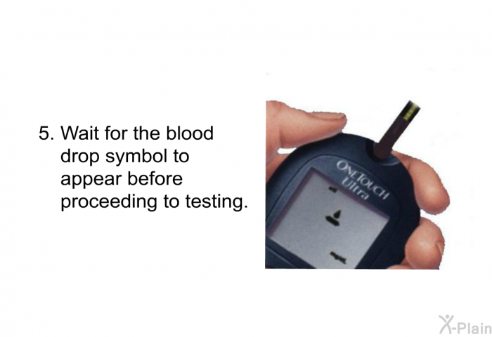 Wait for the blood drop symbol to appear before proceeding to testing.