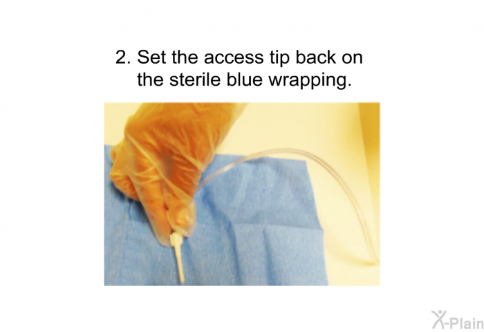 Set the access tip back on the sterile blue wrapping.